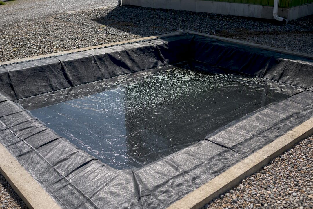 Concrete washout lined pit containment