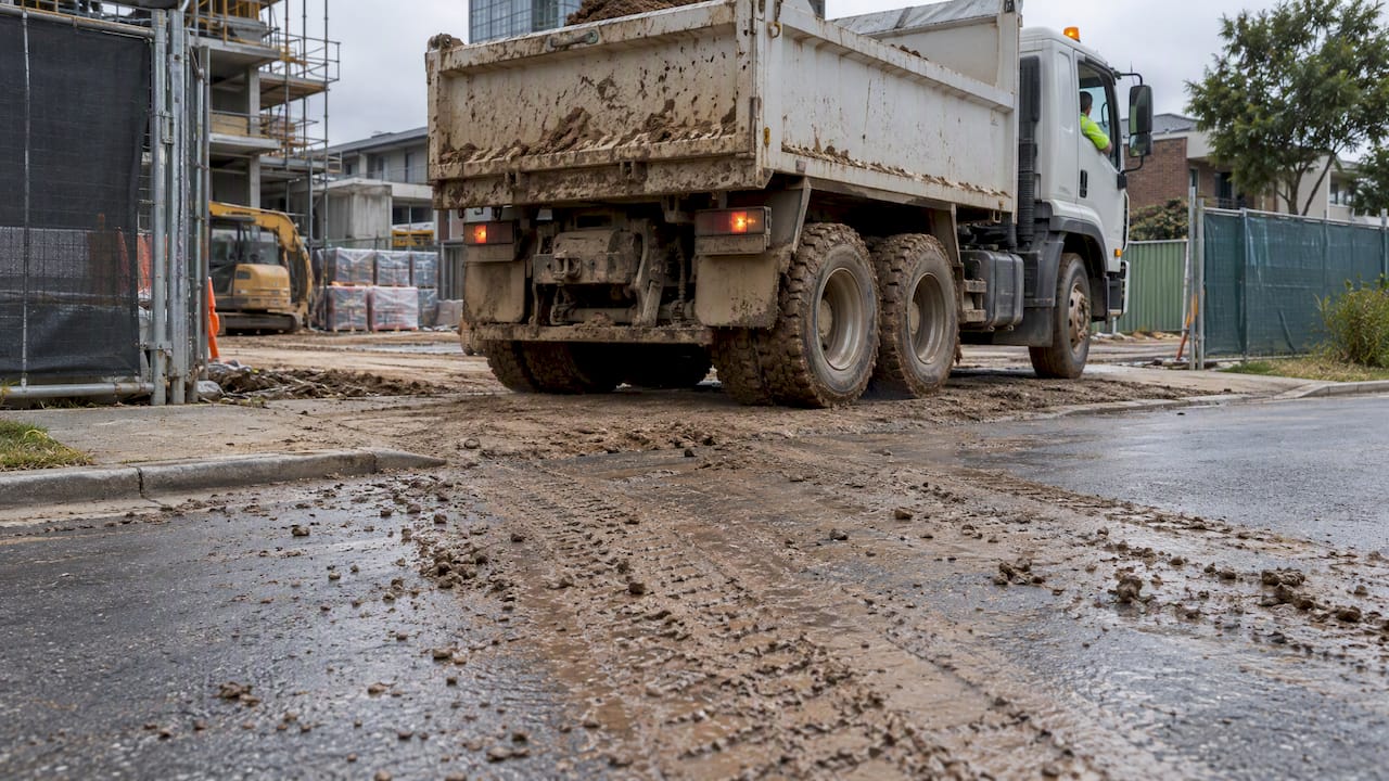 Mud tracked from a construction site onto road